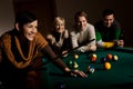 Woman laughing at snooker table Royalty Free Stock Photo