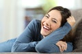 Woman laughing with perfect teeth looking at you