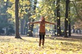 Woman laughing after throwing leafs