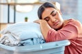 Woman, laundry basket and sleep while tired, relax or rest in living room after cleaning, wash and packing. Housewife Royalty Free Stock Photo