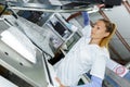 Woman laundry worker at dry cleaners Royalty Free Stock Photo