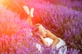 Woman lavender field. A middle-aged woman lies in a lavender field and enjoys aromatherapy. Aromatherapy concept Royalty Free Stock Photo