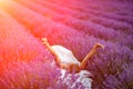 Woman lavender field. A middle-aged woman lies in a lavender field and enjoys aromatherapy. Aromatherapy concept Royalty Free Stock Photo