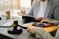 Woman lawyer hand and women client shaking hand collaborate on working agreements with contract documents at the office Royalty Free Stock Photo