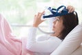 Woman lay in bed wearing CPAP mask ,sleep apnea therapy Royalty Free Stock Photo