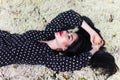 Woman laying on a dry moss Royalty Free Stock Photo