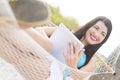 Woman Laying in hammok with Tablet Royalty Free Stock Photo