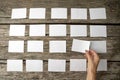 Woman laying out blank white memo notes