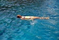 Woman laying on the water