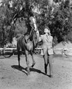 Woman leading horse