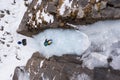 Woman is leading on Ice. Ice Climbing on Frozen Waterfall, Drone Shot. Barskoon Valley, Kyrgyzstan