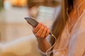 Woman leaning on the bar counter and text messaging with her mob Royalty Free Stock Photo