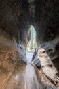 Woman Leans on Sequoia Trunk