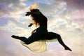 Woman Leaping through the Air Royalty Free Stock Photo