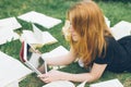 Woman learning with ebook reader and book. Choice between modern educational technology and traditional way method. Girl holding d