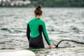 Woman learning how to windsurf