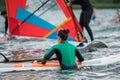 Woman learning how to windsurf