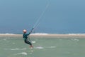 Woman learning kitesurfing, girl at kiteboarding school. Kite surf lessons in the Canary islands, Fuerteventura. Girl doing the