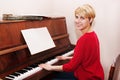 Woman learning to play the piano Royalty Free Stock Photo