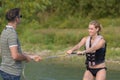 Woman learning to waterski with instructor Royalty Free Stock Photo