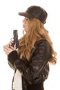 Woman leather pistol blow side Royalty Free Stock Photo