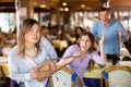 Woman leaving restaurant after stealing handbag