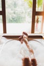 Woman legs in bath foam. Enjoying and relaxation Royalty Free Stock Photo