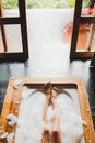 Woman legs in bath foam. Enjoying and relaxation Royalty Free Stock Photo