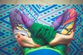 Woman legs in colorful leggings in lotus pose from above view in