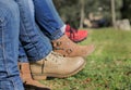 Woman legs crossed with cowboy pants and boots Royalty Free Stock Photo