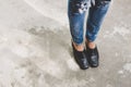 Woman legs in denim pants black stylish high heels shoes outdoo Royalty Free Stock Photo