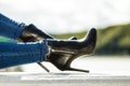 Woman legs in denim pants heels shoes outdoor Royalty Free Stock Photo