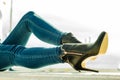 Woman legs in denim pants heels shoes outdoor Royalty Free Stock Photo