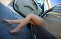 Woman legs exit the car Royalty Free Stock Photo