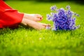 Woman legs on green grass with flower dress. Summer vacation concept. backlit Royalty Free Stock Photo