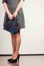Woman legs in high heels shoes handbag in hand Royalty Free Stock Photo