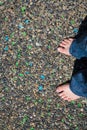 Female bare foot colorful pavement high angle shot Royalty Free Stock Photo