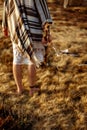 Woman legs in native indian american boho dress walking in windy Royalty Free Stock Photo