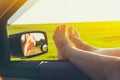 Woman legs out car window