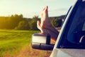 Woman legs out car window Royalty Free Stock Photo