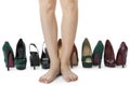 Woman Legs in Red Shoes Between Other High Heels Royalty Free Stock Photo