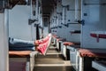 Woman legs in red tennis shoes in a vintage empty train car. Fem Royalty Free Stock Photo