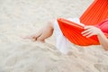 Woman legs relaxing on hammock