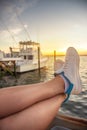 Woman legs relaxing on the yacht in the sea bay Royalty Free Stock Photo