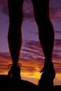 Woman legs walk sunset