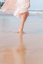 Woman legs walking on the beach sand Royalty Free Stock Photo