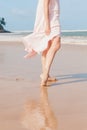Woman legs walking on the beach sand Royalty Free Stock Photo
