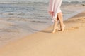 Woman legs walking on the beach sand Royalty Free Stock Photo