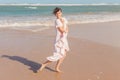 Woman legs walking on the beach sand Royalty Free Stock Photo