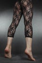 Woman legs wearing black lace leggins